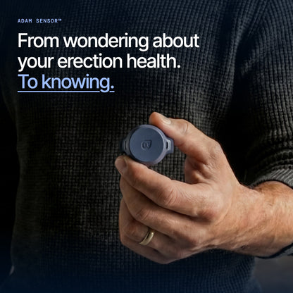 A man's hand holding the Adam Sensor